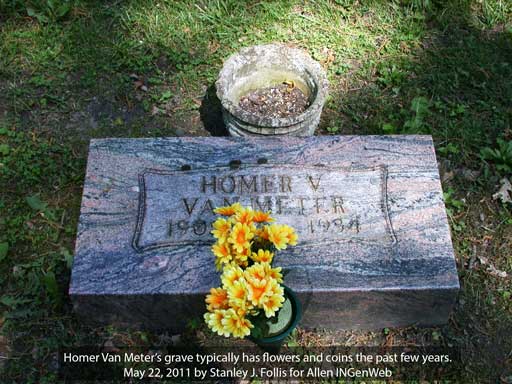 Coins on Homer Van Meter's grave